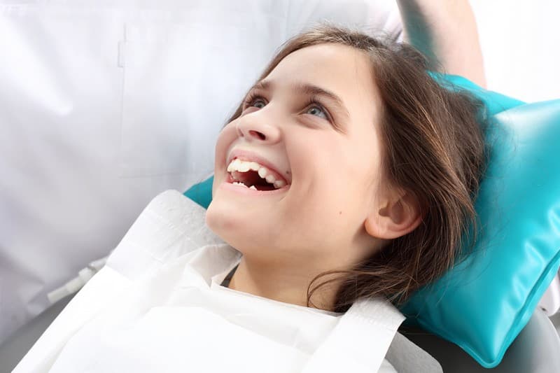 A Smiling Child after Dental Procedure